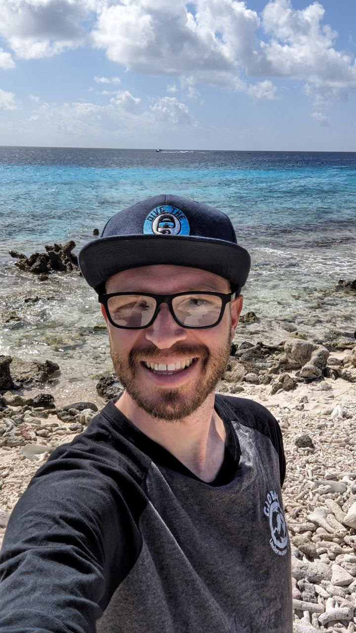 Marcelin Nebenhaus @dive_the_cave smiling on a beach